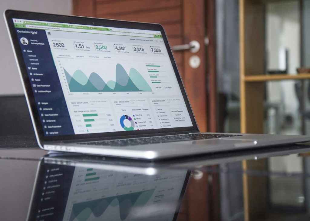 Laptop showing search statistics similar to the Google Search Console Performance report