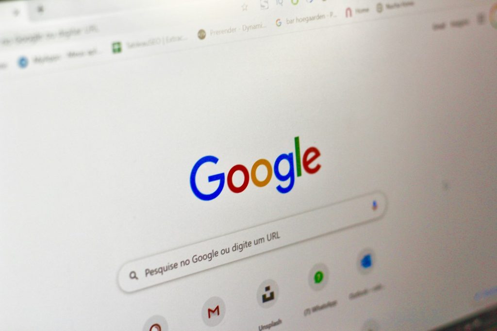 Google search homepage on a computer screen, where SEO vs SEM results compete for clicks